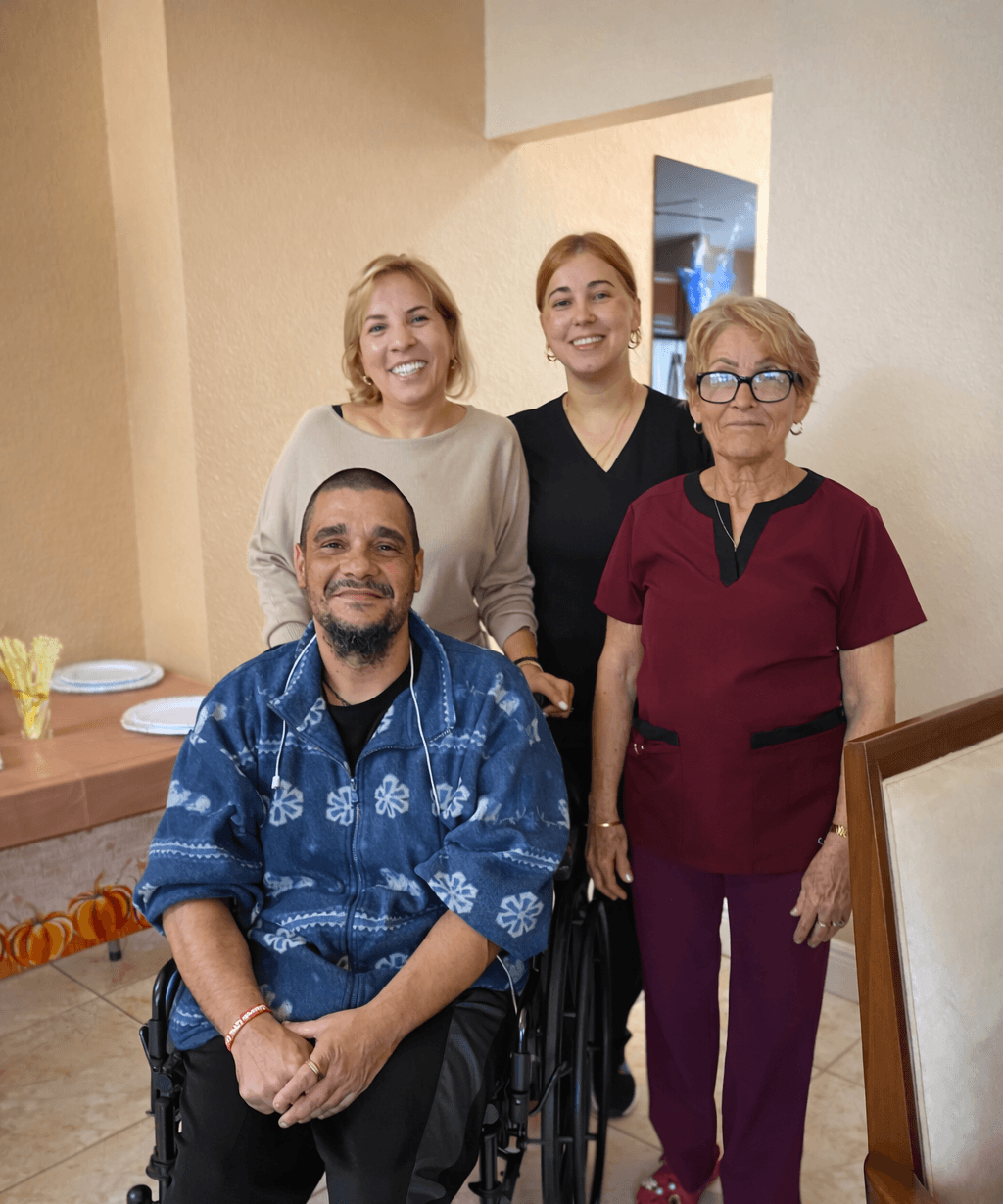 Staff and residents smiling together